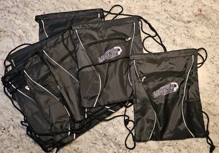Drawstring bags printed with a soccer team logo