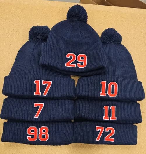 Beanies embroidered with different player numbers
