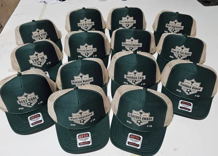 A full set of end-of-season award caps, one per award (Golden Glove, Best Goal, Coaches Award and more)